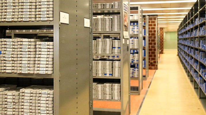 looking down the hallway at shelves of audio cartridges.